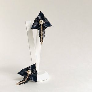 Black floral Rocky style stud earrings